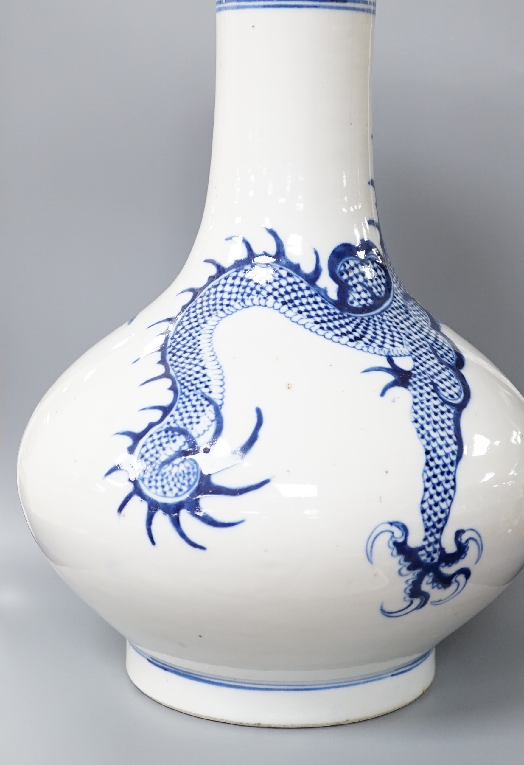 A Chinese blue and white ‘dragon’ bottle vase 32cm